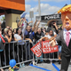 Onlookers yell at a Donald Trump piñata during a "Take It Out on Trump" event in East Los Angeles in September 2015.
Mel Melcon/Los Angeles Times